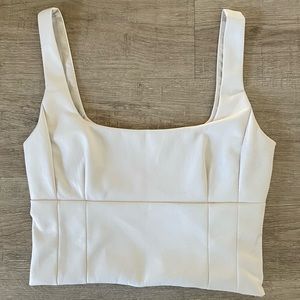 Cropped ivory bustier style top, size small. Never worn.